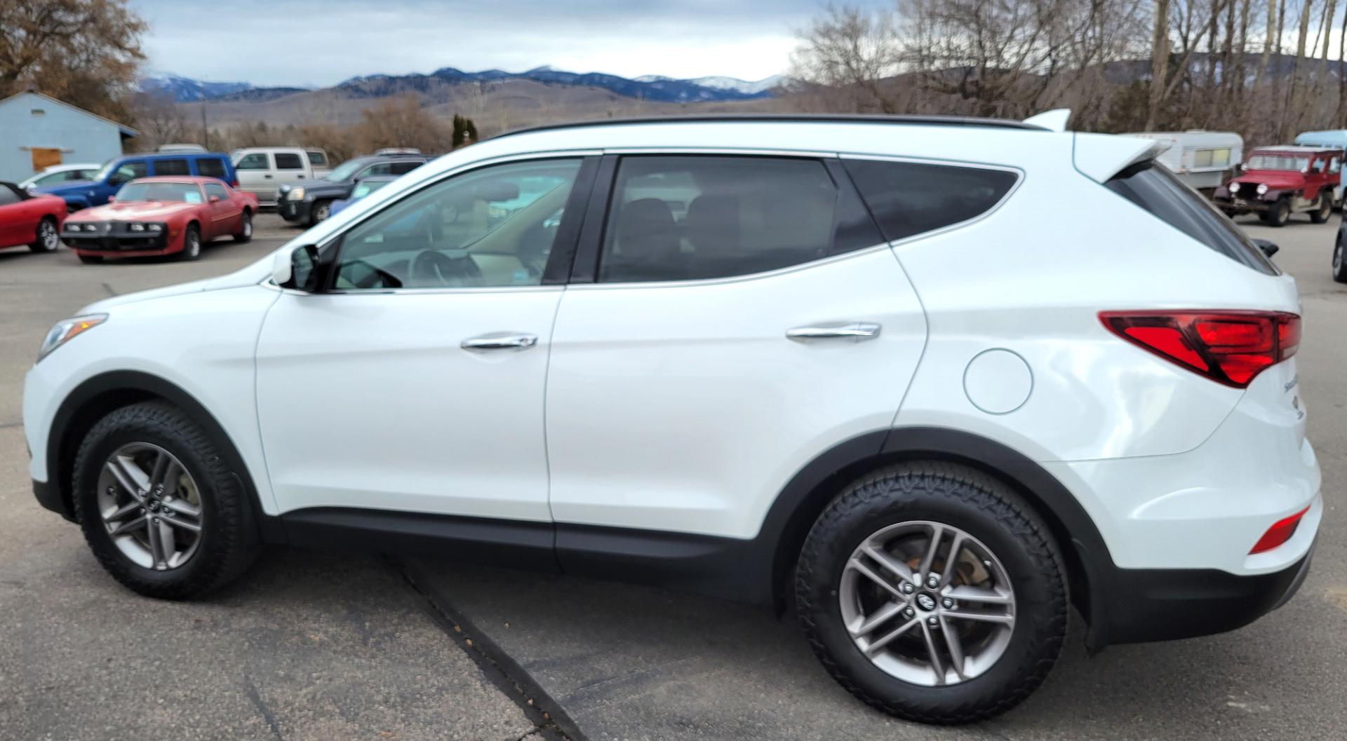 2017 White /Tan Hyundai Santa Fe Sport (5NMZUDLB9HH) with an 2.4L I4 engine, 6 Speed Auto transmission, located at 450 N Russell, Missoula, MT, 59801, (406) 543-6600, 46.874496, -114.017433 - Really Nice AWD SUV. 2.4L I4. 6 Speed Automatic Transmission. Remote Start. Backup Camera. Bluetooth. AM FM XM CD. Air. Cruise. Tilt. Power Windows and Locks. One Owner. Clean Carfax. - Photo#0